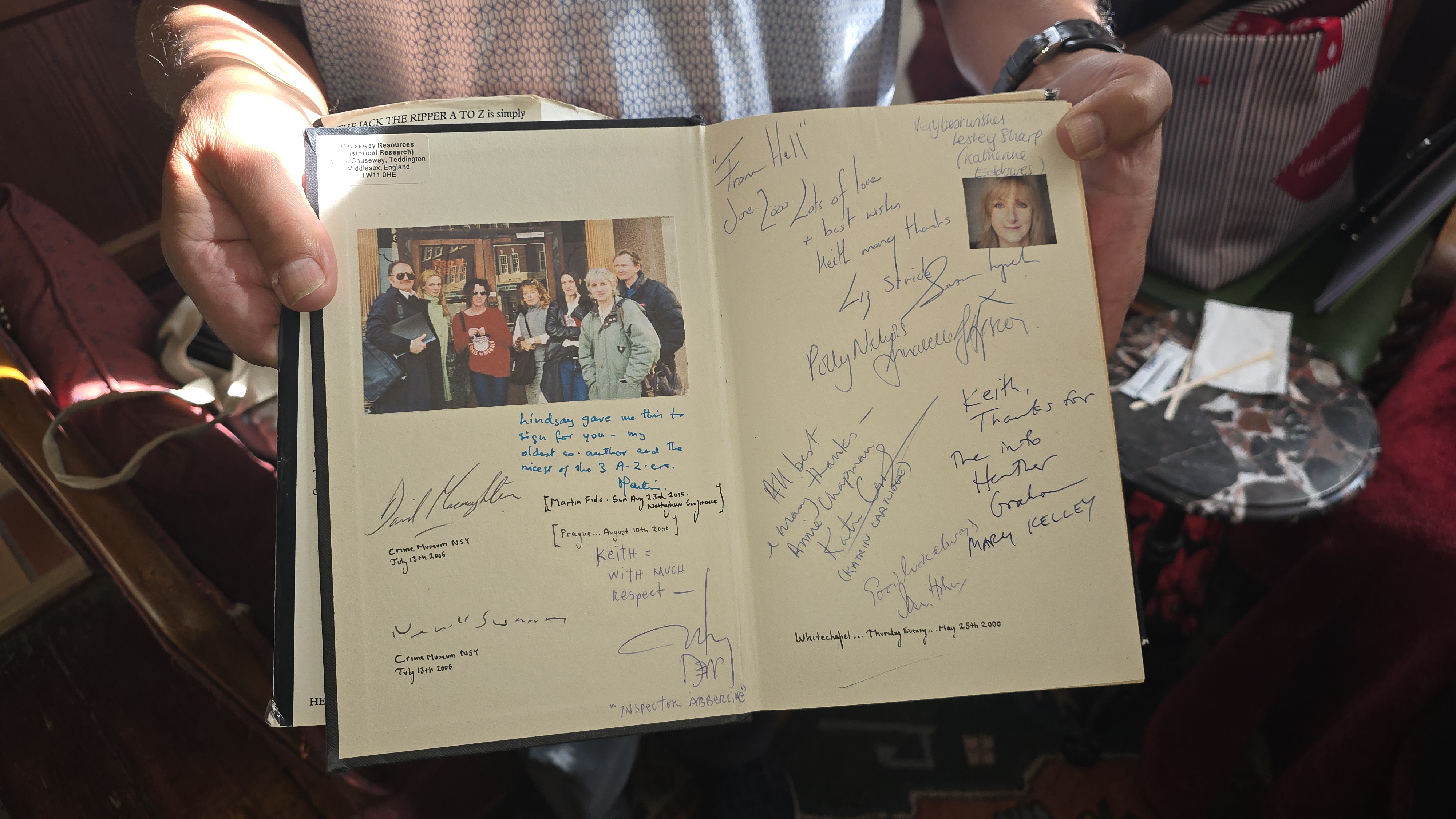 Close on the signed pages of The Jack the Ripper A to Z, signed by the From Hell cast