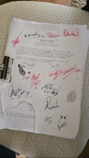 The signed front page of the Echoes of Crimson script, covered in cast signatures and drawings