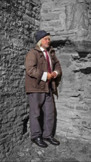 Dr Martin against the churchyard wall