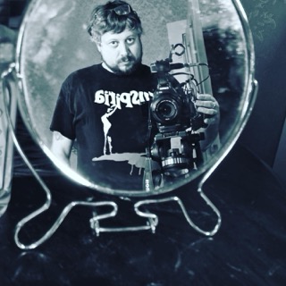 Jason Impey reflected in a mirror with the camera