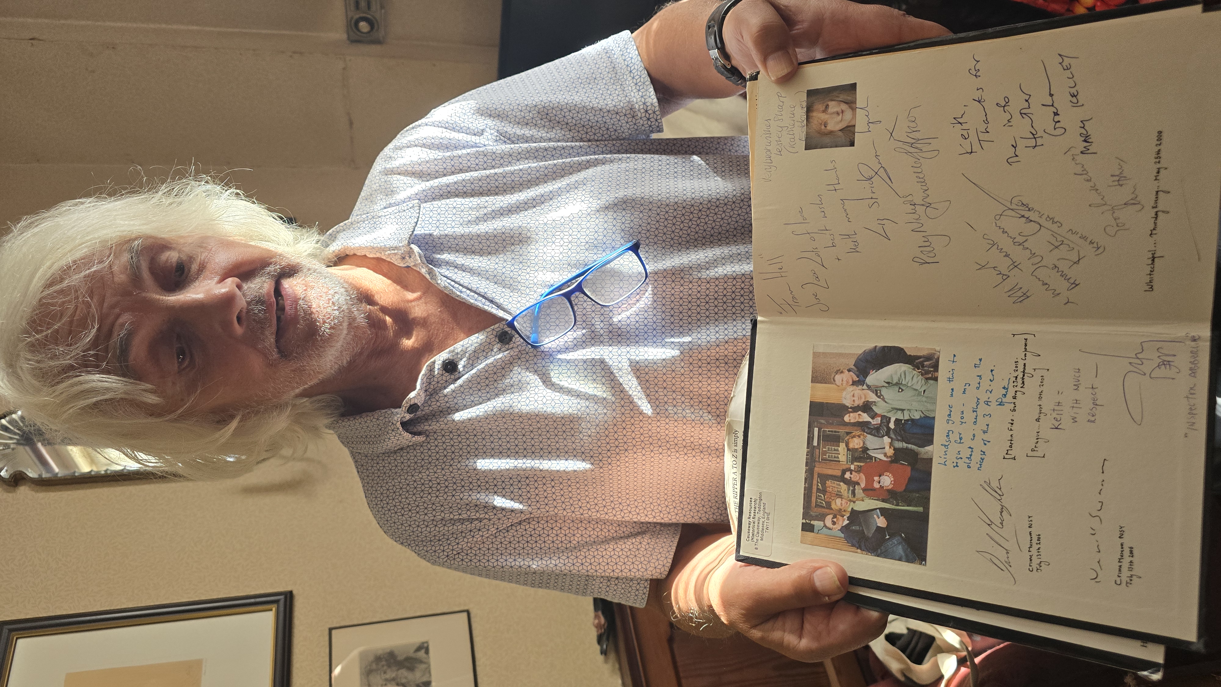 Keith Skinner holding his signed copy of The Jack the Ripper A to Z