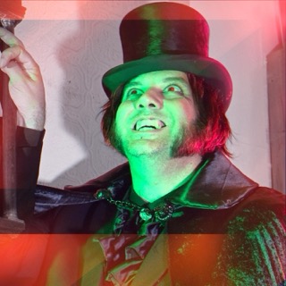 The Ripper looking up, lit in green and red